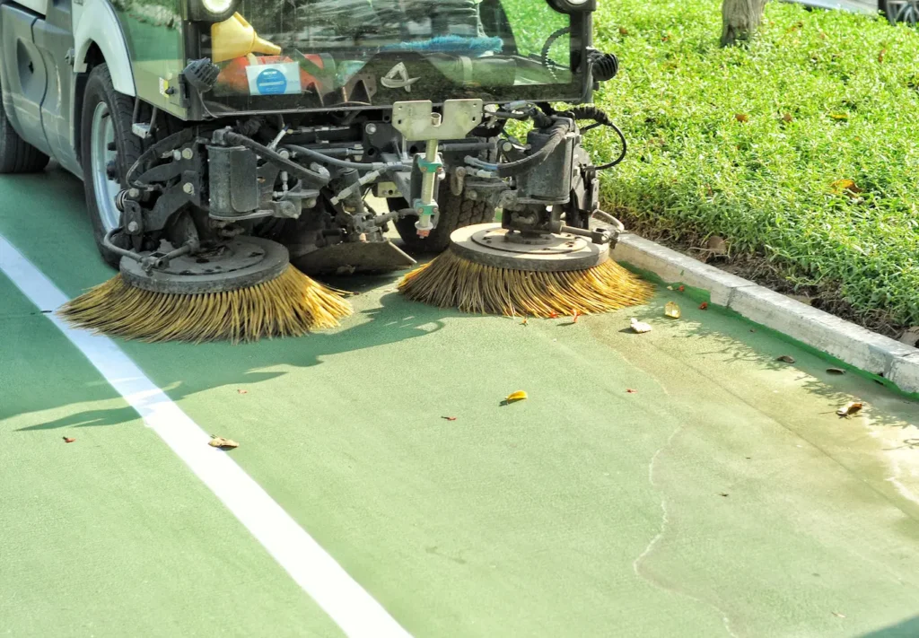 Earth Neutral Mechanised sweeping crew reviewing a route deployment plan