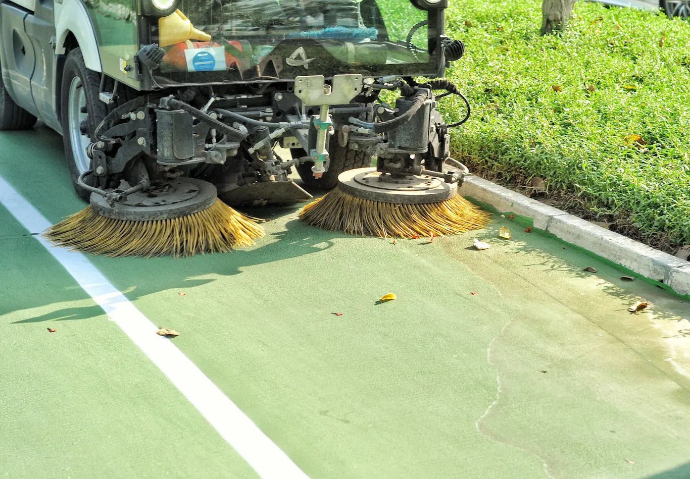 Earth Neutral Mechanised sweeping crew reviewing a route deployment plan